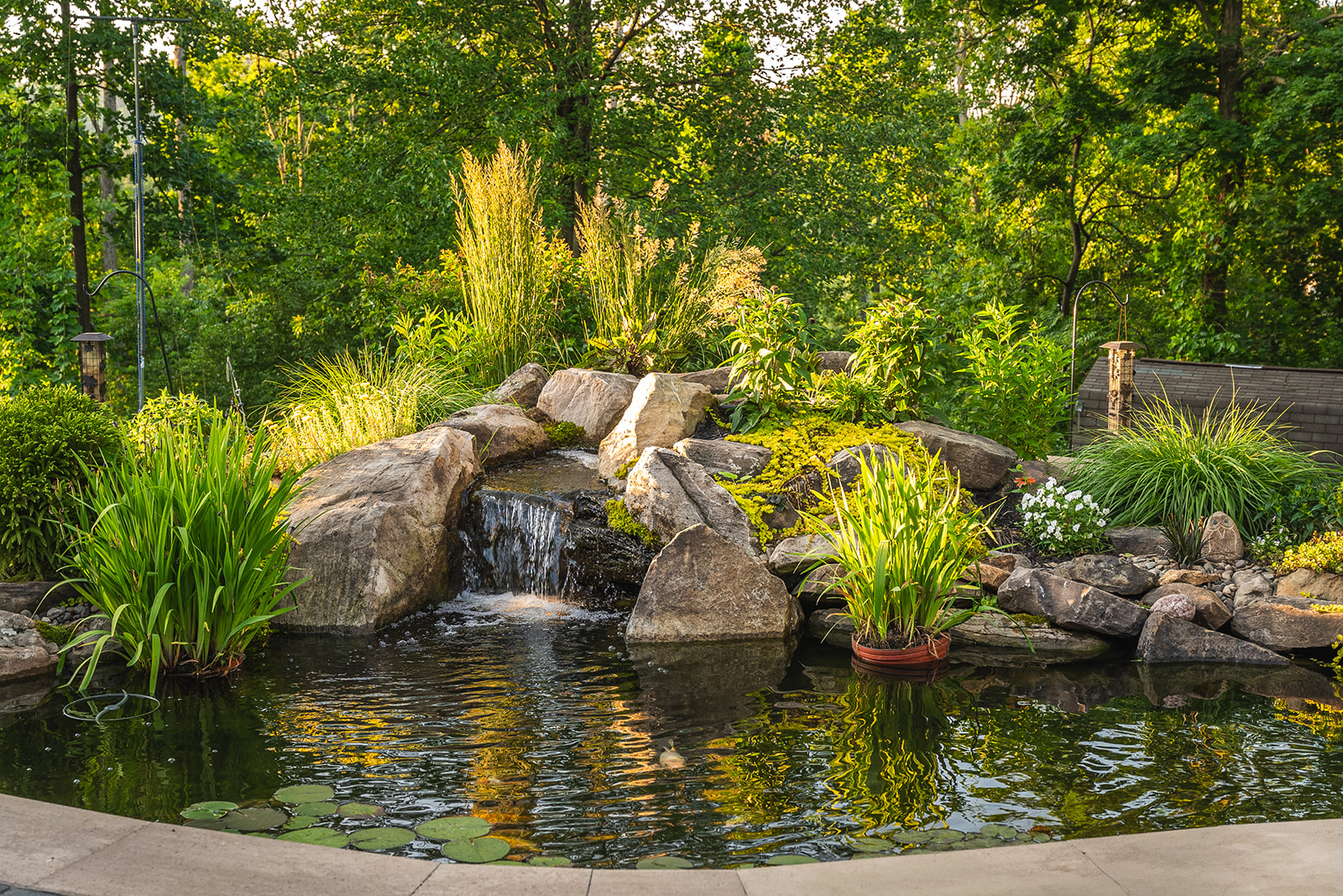 A Beautiful Backyard Patio Paradise Hardscape Installation 15 A backyard pond with water feature Hardscape Installation in Birdsboro PA