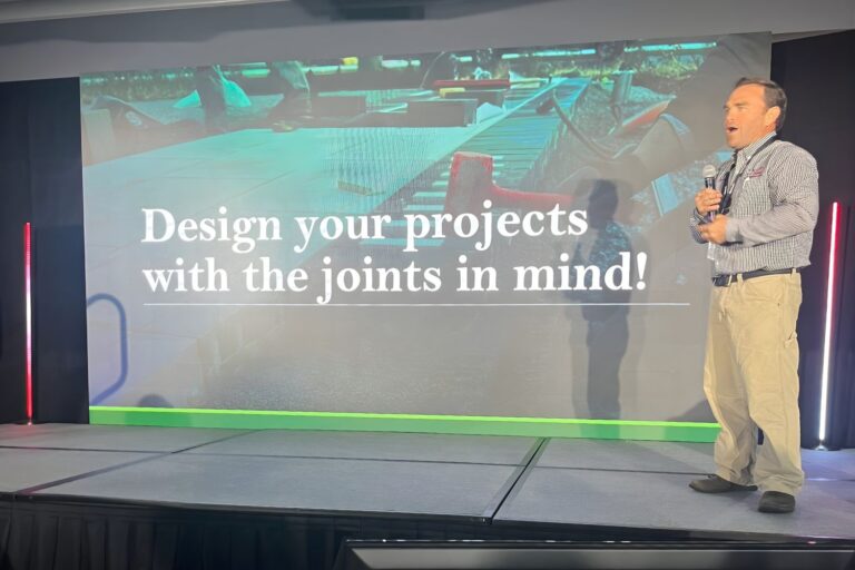 Mahlon Stoltzfus speaking at SynkedUp Summit in September of 2025