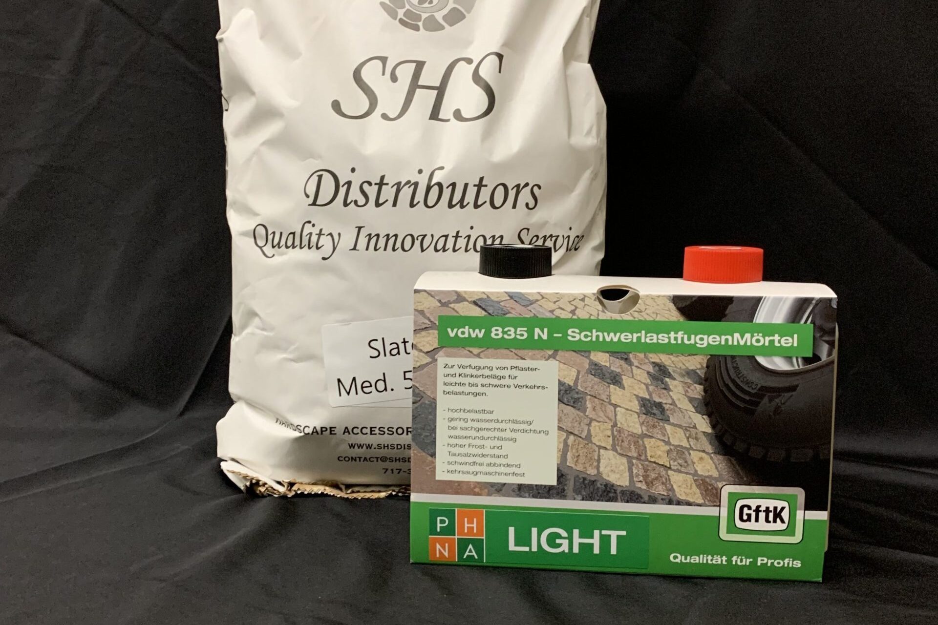SHS Distributors grout materials including VDW 835 N joint mortar displayed on a black background