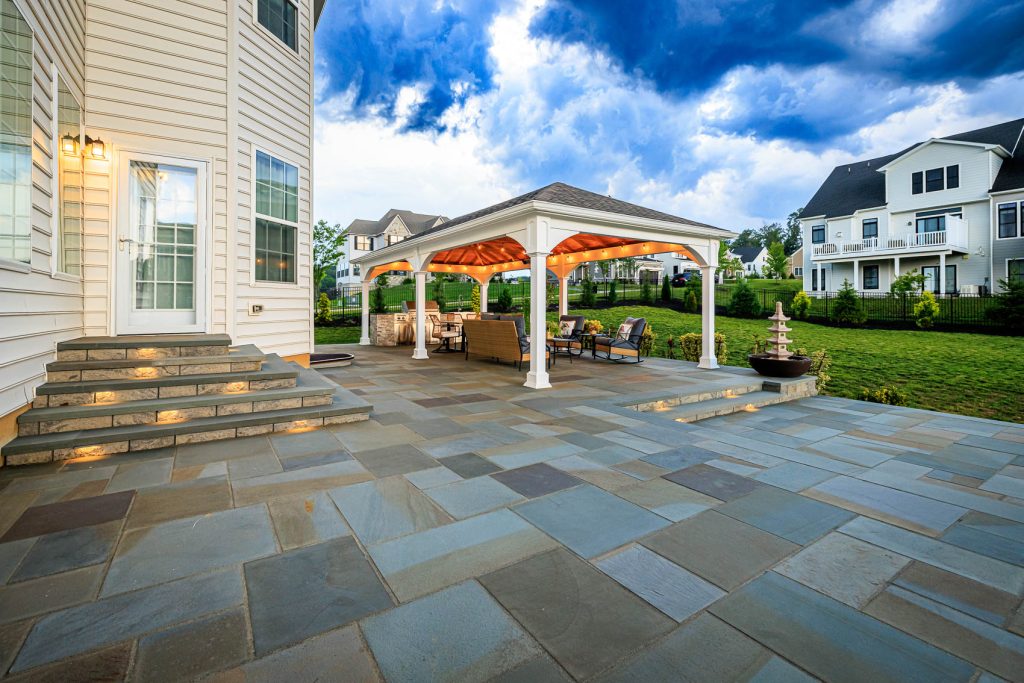 A Blend Of Function and Beauty – Newtown Square, PA 4 A custom pavilion covers a versatile outdoor kitchen and dining space in this beautiful new town, pa, hardscape installation