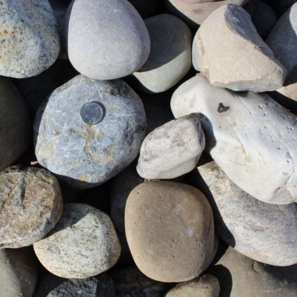 aerial closeup of new 2-4 inch england river rock for sale through Sauders