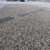 photo of a finished walkway with washed gravel earth color for sale